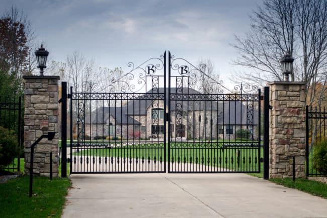 ornate gate for driveway of a large home