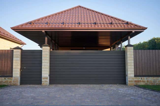 Powered sliding gate with side pedestrian gate